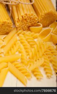 bunch of Italian pasta type on a white rustic table