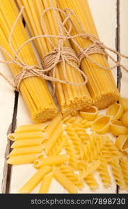 bunch of Italian pasta type on a white rustic table