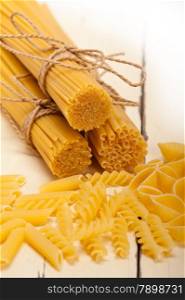 bunch of Italian pasta type on a white rustic table
