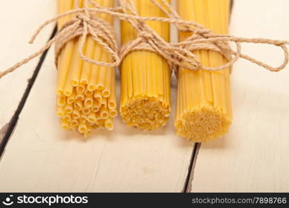 bunch of Italian pasta type on a white rustic table