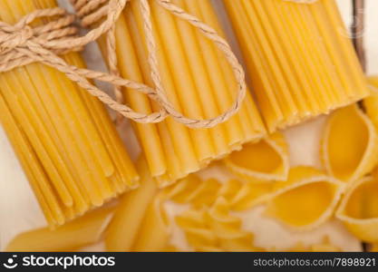 bunch of Italian pasta type on a white rustic table