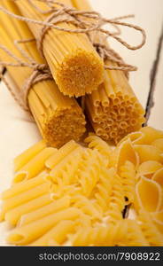 bunch of Italian pasta type on a white rustic table