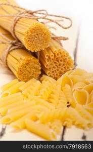 bunch of Italian pasta type on a white rustic table