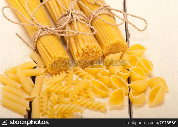 bunch of Italian pasta type on a white rustic table