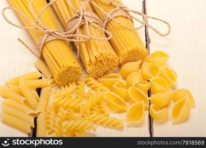 bunch of Italian pasta type on a white rustic table