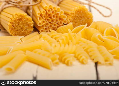 bunch of Italian pasta type on a white rustic table