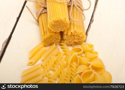 bunch of Italian pasta type on a white rustic table