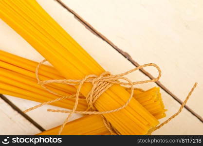 bunch of Italian pasta type on a white rustic table 