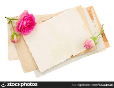 bunch of old papers with roses isolated on white background