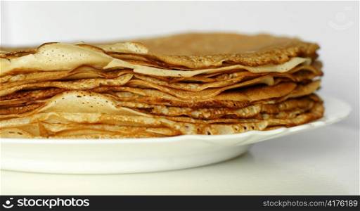bunch of pancakes on a plate. pancakes