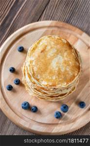 Bunch of pancakes with fresh blueberries