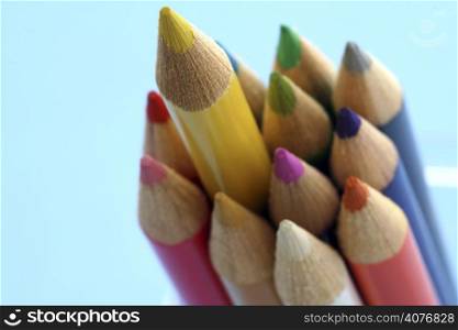 Bunch of pencils with one pencil sticks out, can be used for leadership symbol.
