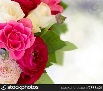 bunch of pink ranunculus and rose flowers close upwith copy space on bokeh background. bunch of pink ranunculus flowers