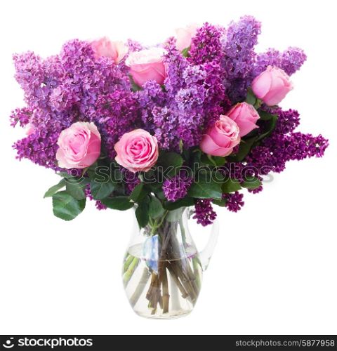 Bunch of purple Lilac flowers with pink roses in vase isolated on white background. Lilac flowers