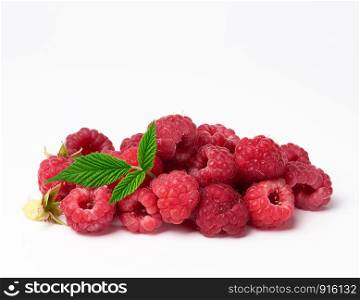 bunch of red ripe raspberries and green leaf on a white background, summer sweet crop