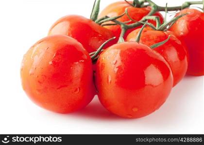 Bunch of ripe tomatoes isolated on white background