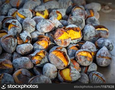 Bunch of roasted chestnuts at street vendor