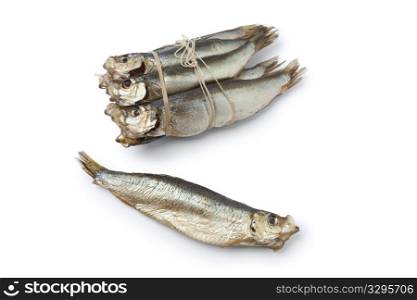 Bunch of smoked pearlsides fishes, Maurolicus muelleri, on white background