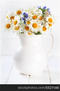 bunch of summer flowers in a jug
