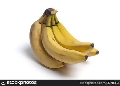 Bunch of unpeeled bananas on white background