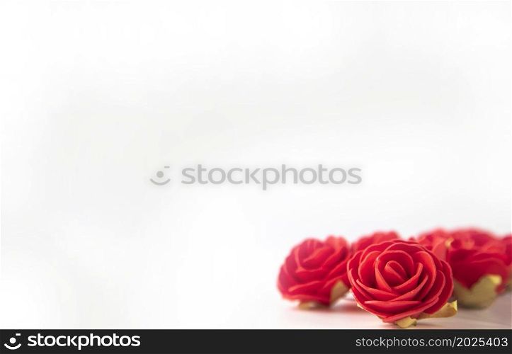 Bunch of velvet red roses isolated on white background .Roses Art Design . Frame made roses, green leaves Valentine&rsquo;s background with roses. Valentines day card concept. romantic space for text. Bunch of velvet red roses isolated on white background .Roses Art Design . Frame made roses, green leaves Valentine&rsquo;s background with roses. Valentines day card concept. romantic