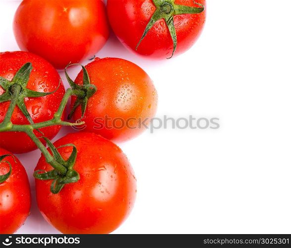 Bunch of vine salad tomatoes on a white table
