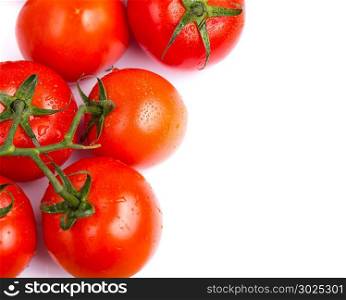 Bunch of vine salad tomatoes on a white table