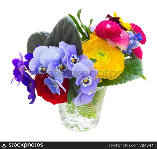 Bunch of violets, pansies, daisies and ranunculus in glass isolated on white background. Posy of violets, pansies and ranunculus