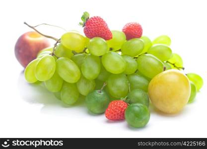 bunch of white grapes, peach and yellow plum isolated on white