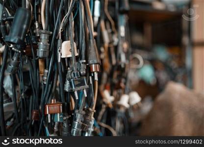 Bunch of wires with different plugs, nobody. Electrical testing tools in laboratory closeup. Lab equipment, engineering workshop