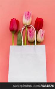 bunch various tulips paper bag