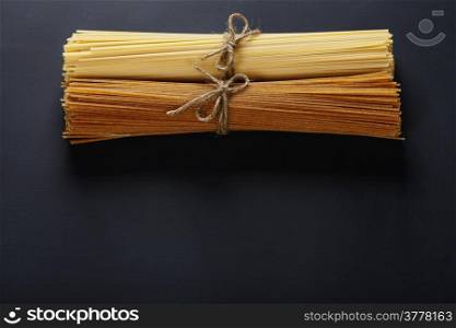 Bunches of spaghetti on dark background