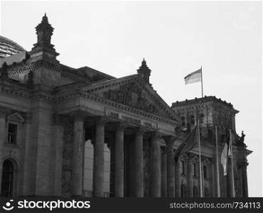 Bundestag German Houses of Parliament in Berlin, Germany. Dem deutschen Volke means To the German people in black and white. Bundestag parliament in Berlin in black and white