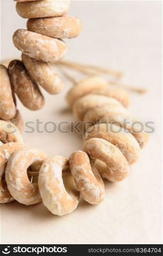bundle of bagels on a white tablecloth in natural light