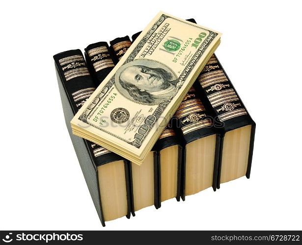 Bundle Of Dollars On The Books On White Background