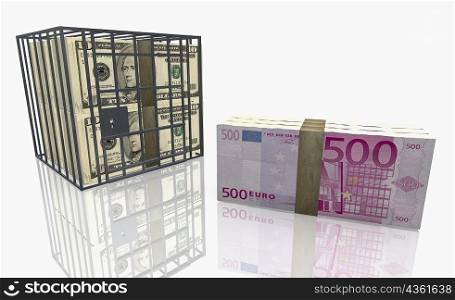 Bundle of five hundred Euro bank notes next to American dollar bills in a cage