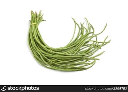 Bundle of fresh Chinese long beans on white background