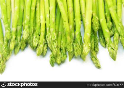 Bundle of green asparagus shoots isolated over white