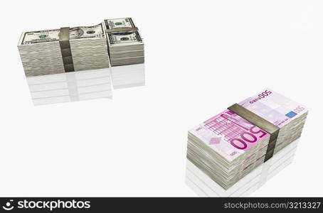 Bundles of American ten dollar bills and five hundred Euro banknotes