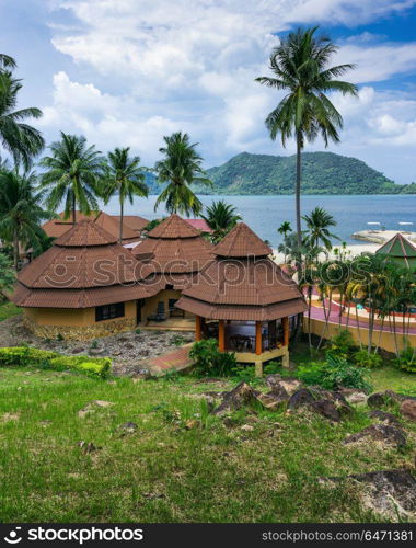 Bungalows in a tropical garden on the beach. KOH CHANG, THAILAND - 1 APRIL, 2015: FuramaXclusive Resort & Spa Aiyapura. Bungalows in a tropical garden on the beach