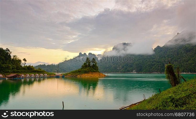 Bungalows mountains and lake in the sunrise at Ratchaprapha Dam, Khao Sok National Park, Surat Thani Province, Thailand