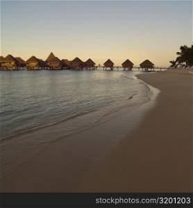 Bungalows over Water and Beach at Moorea in Tahiti