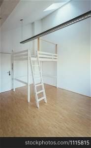 Bunk bed in a modern and bright little flat, tiny living
