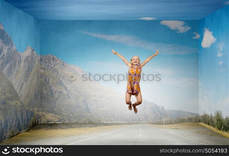 Buoyant and happy. Little cute girl jumping high and flying in sky