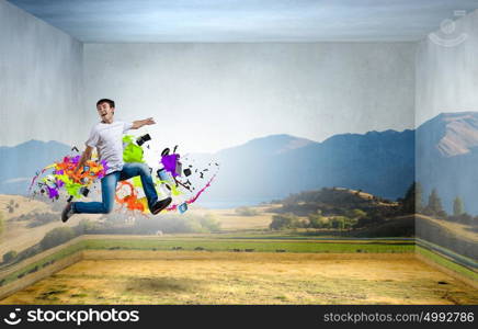 Buoyant and happy. Young man jumping in sky in 3d room