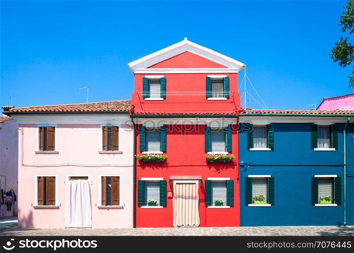 Burano Isle, close to Venice. Traditional colored houses during a sunny day.