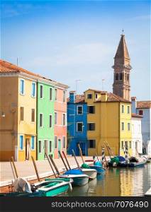Burano Isle, close to Venice. Traditional colored houses during a sunny day.