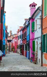 BURANO, ITALY - NOVEMBER 23: Brightly painted houses at the Burano canal on November 23, 2015 in Burano, Venice, Italy. It&rsquo;s an island in the Venetian Lagoon, northern Italy.