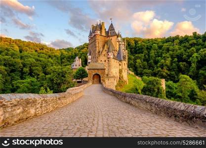 Burg Eltz castle in Rhineland-Palatinate state at sunset, Germany. Construction started prior to 1157.