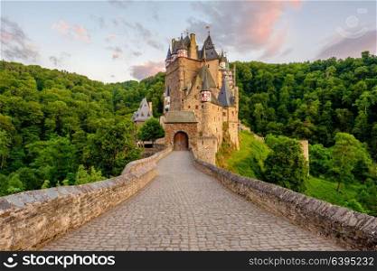 Burg Eltz castle in Rhineland-Palatinate state at sunset, Germany. Construction started prior to 1157.